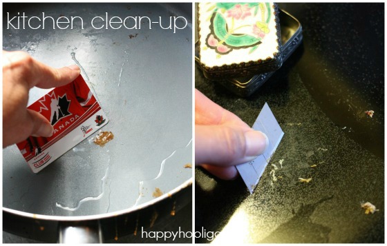 cleaning pan and glass top stove with credit card and razor