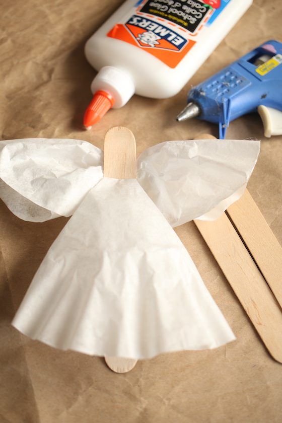 Gluing coffee filters to popsicle stick