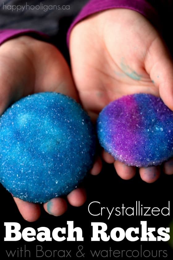 Kids holding stones covered in Borax crystals