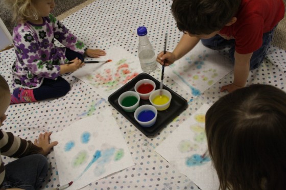 kids colouring paper towel with coloured water