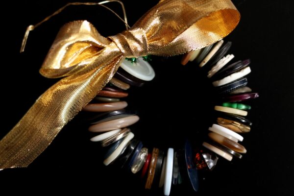 pipe cleaner and button wreath with gold bow