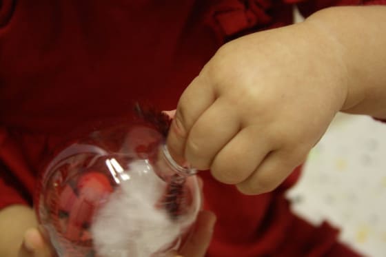 filling the clear glass ornaments 