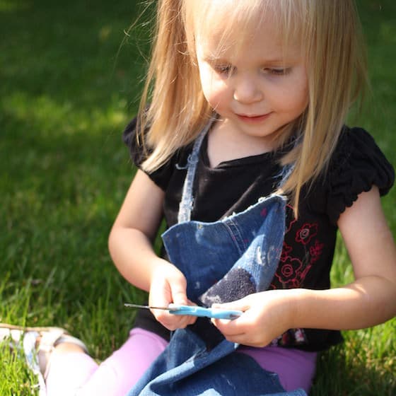 preschooler holding scissors