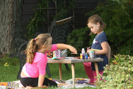 girls making crafts outside