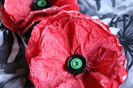 coffee filter poppies painted red with black button in center and green button on top