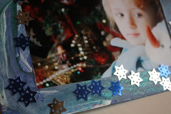 photo of preschooler in homemade cardboard frame