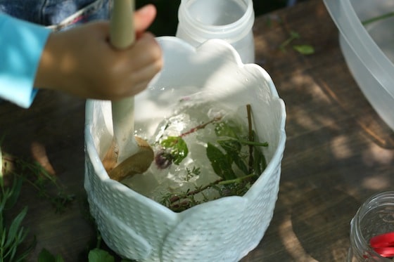 stirring fresh herbs into water activity