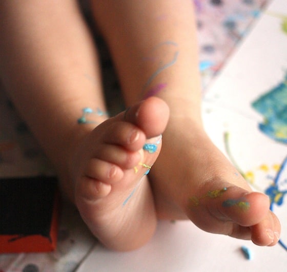 Paint splattered toddler feet