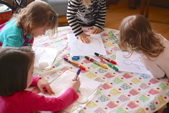 kids drawing on reusable plastic page protectors