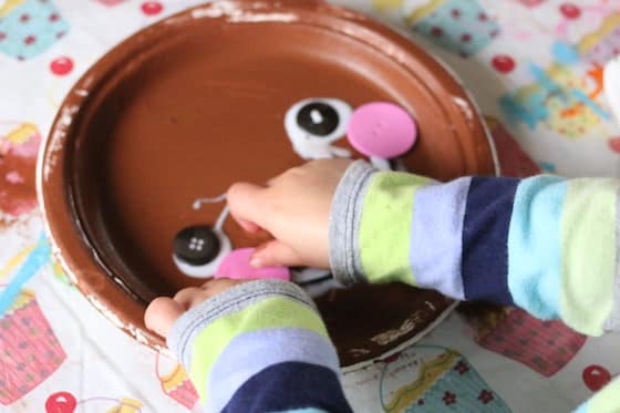 gluing face on gingerbread man craft