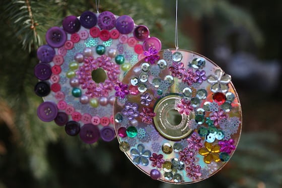 2 cd ornaments decorated with craft gems