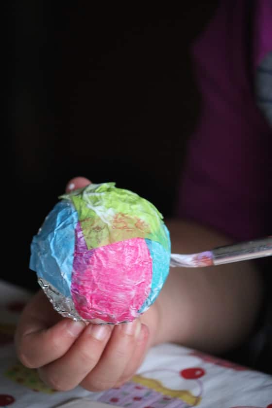 gluing tissue paper to tin foil ball