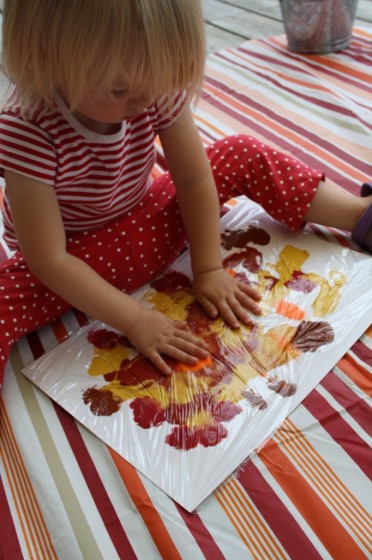 Toddler smoosh painting fall colours for fall collage