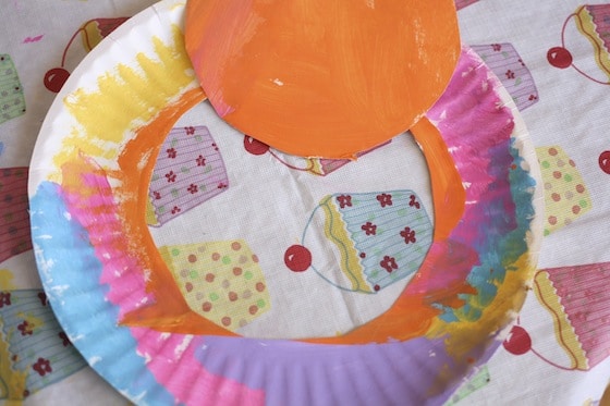 painted paper plate with centre cut out