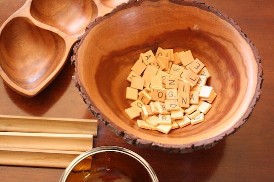 wooden bowl filled with scrabble tiles