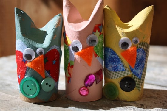 3 toilet roll owls lined up on bench