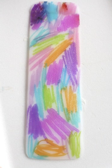 plastic bookmark coloured with sharpies