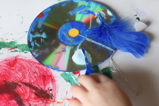 gluing craft feathers on a cd