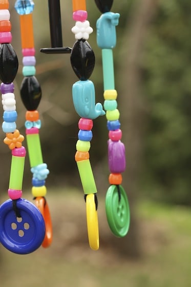 Close up of beads hanging from wind chime