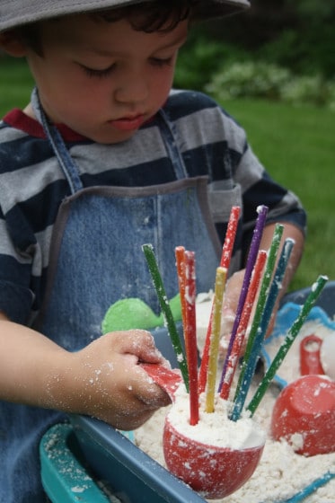 craft sticks in cloud dough