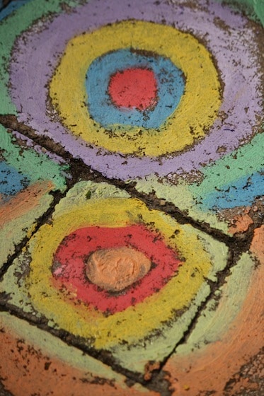 wet sidewalk chalk art on patio stones