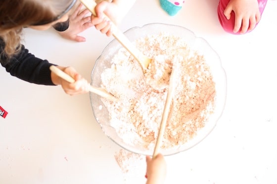 mixing flour and oil in a large bowl