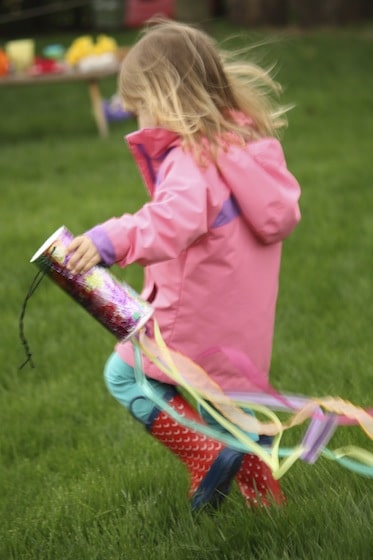 toddler running with windsock