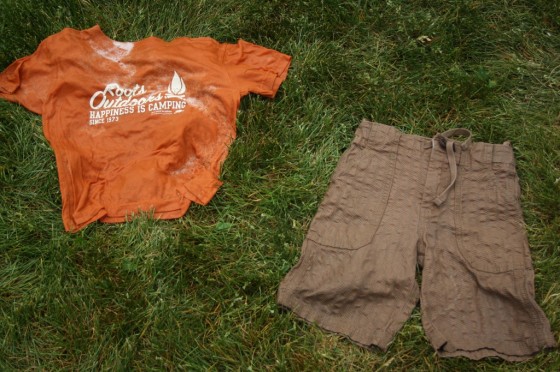 wet clean shirt and shorts laying on grass