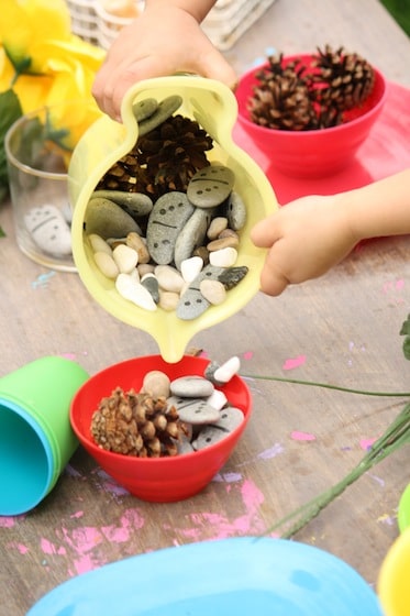 pouding stones into plastic bowl