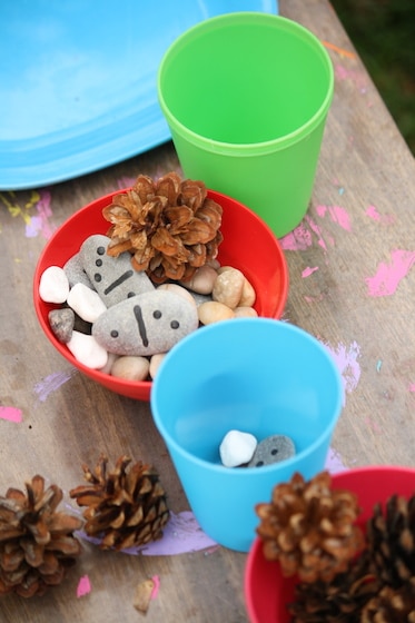 pretend tea party with stones, shells and pinecones