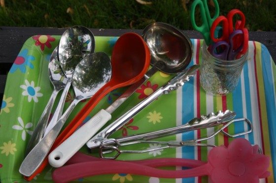 scoops, ladles, tongs on serving tray