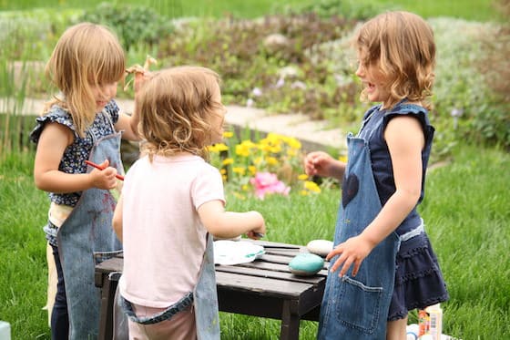 Preschoolers painting rocks