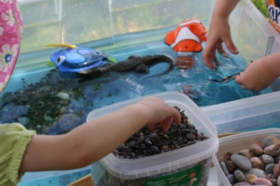 preschoolers playing in ocean sensory bin