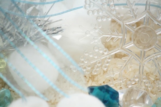 close up tinsel and snowflake ornaments