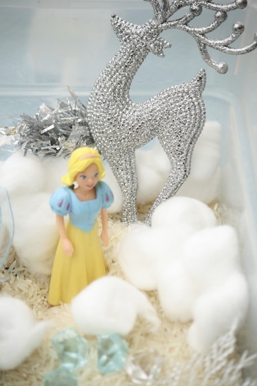 polly pocket as elsa for sensory bin