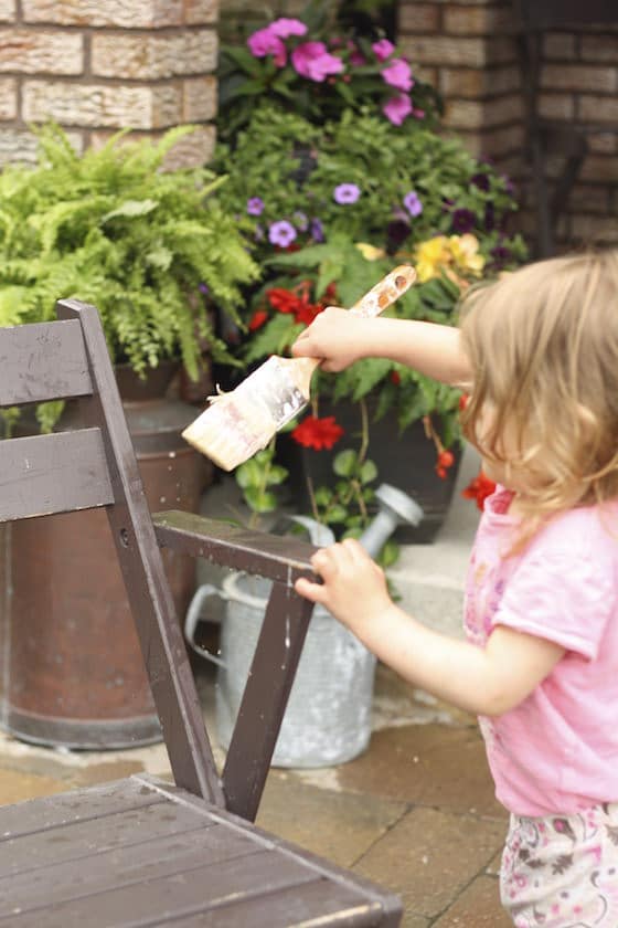 child painting chair with water