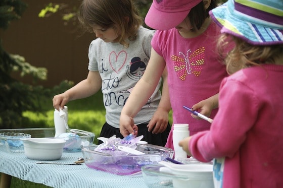 preschoolers melting ice with water and salt