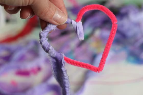 wrapping fabric strip around pipe cleaner heart