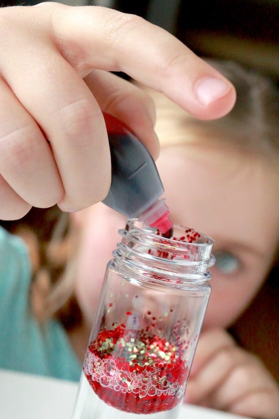 Adding food colour to glitter and water