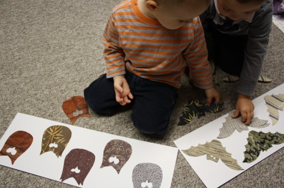 toddlers doing homemade halloween puzzle