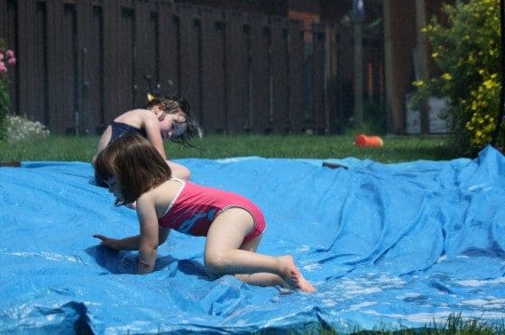 playing on kids water slide