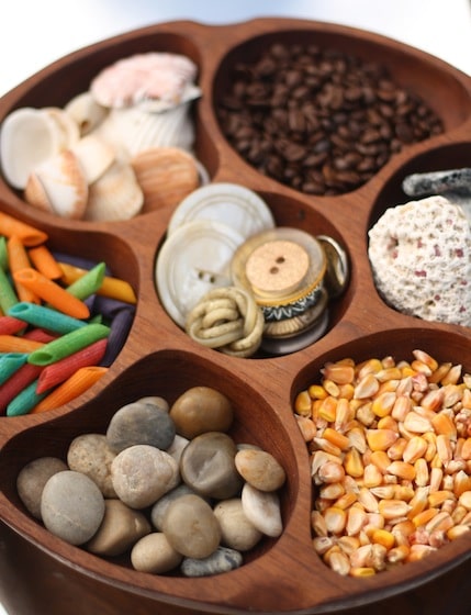 Present sensory materials in a wooden "lazy susan".