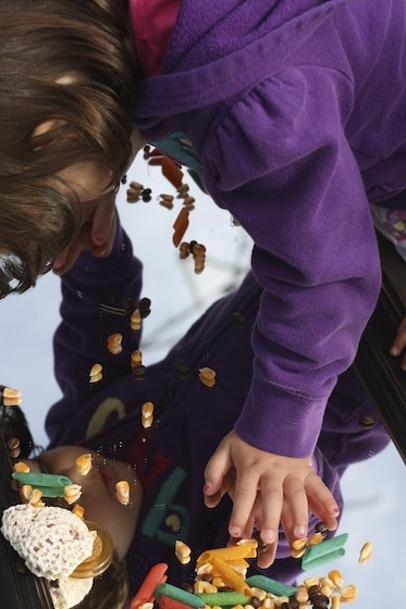 children discovering themselves in the mirrored sensory table