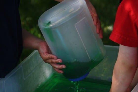 kids pouring coloured water