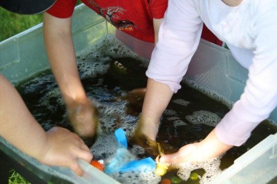 mixing food colouring and water for polly pool party