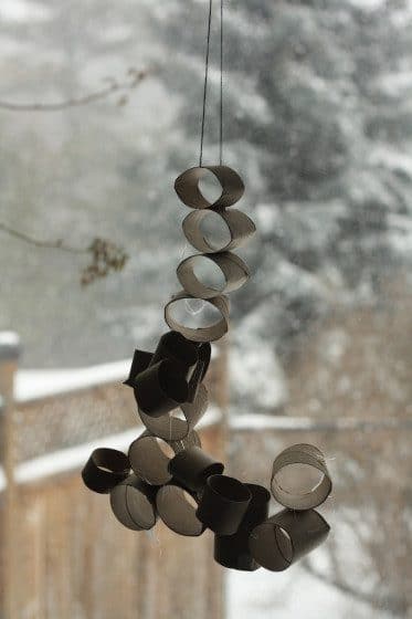 toilet roll structure hanging in front of window