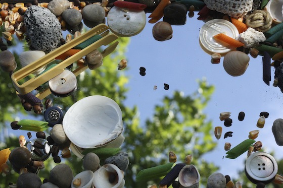 sensory play on a mirror with small loose parts