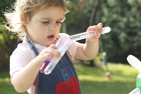 transferring coloured water from one test tube to another