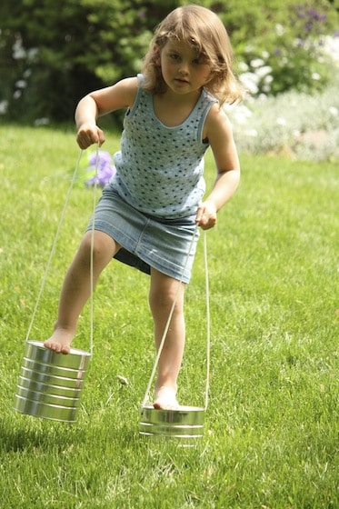 preschooler on homemade stilts