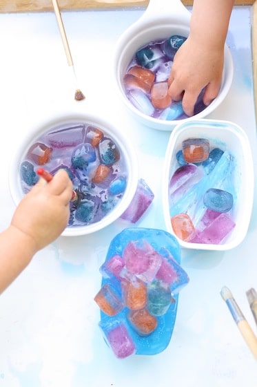 bowls of coloured ice cubes for a science activity for kids